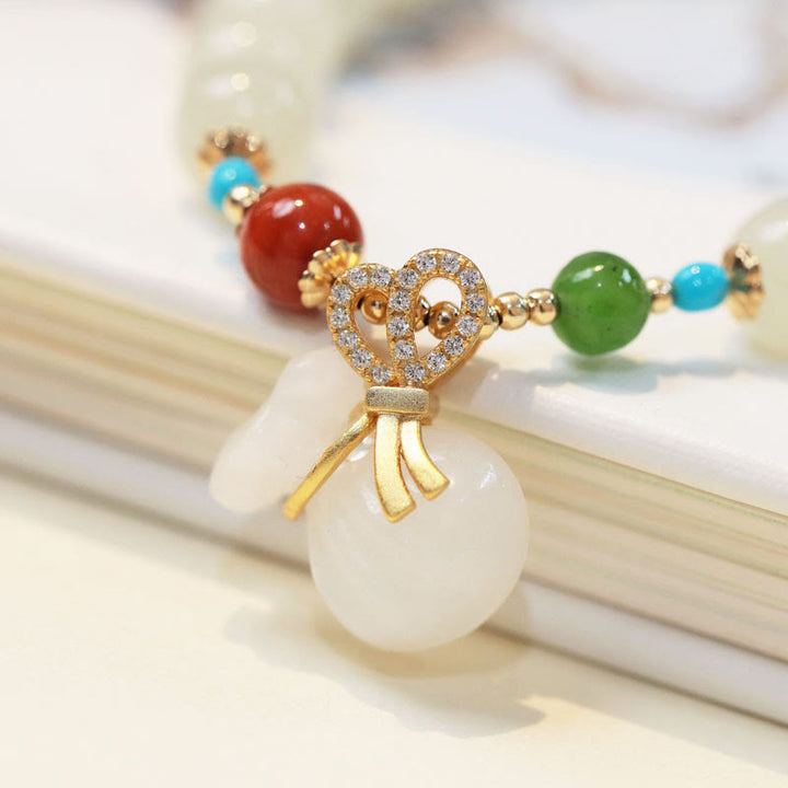Braccialetto di benedizione con sacco di soldi placcato oro 14K in giada bianca naturale di Hetian Buddha Stones
