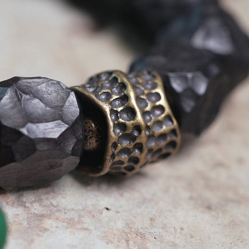 Bracciale Mala da polso con nappa in legno di Buddha Stones tibetano e rame della pace