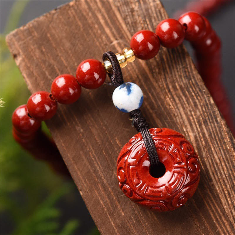 Braccialetto di benedizione a triplo giro con fibbia della pace in cinabro tibetano Buddha Stones Mala