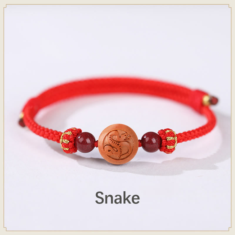 Braccialetto della ricchezza in cinabro intagliato con carattere dello zodiaco cinese Fu in legno di pesca naturale Buddha Stones