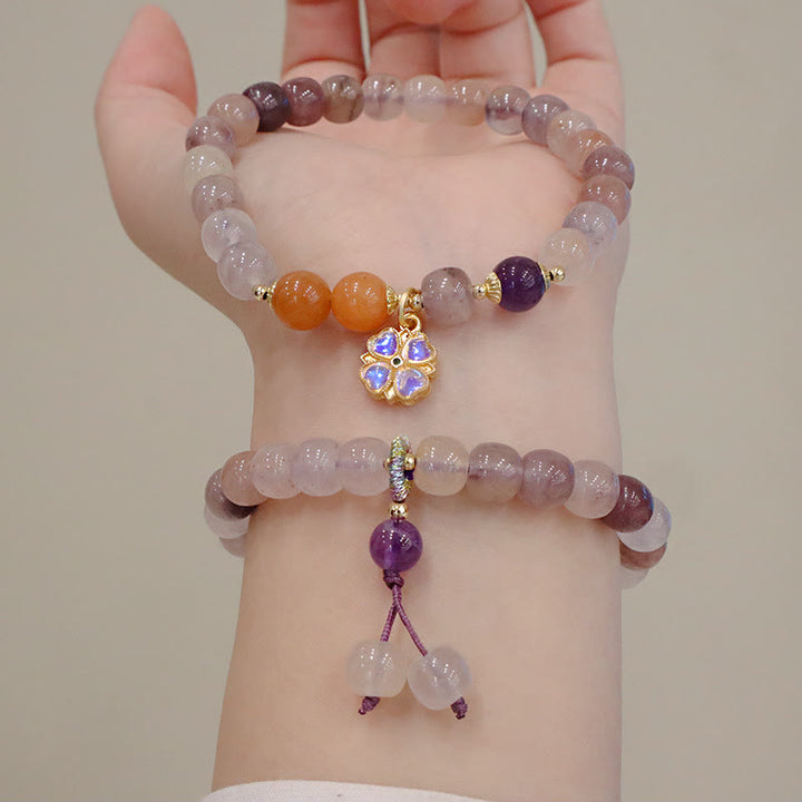 Braccialetto di perline con ciondolo a forma di fiore viola dorato naturale di seta Buddha Stones