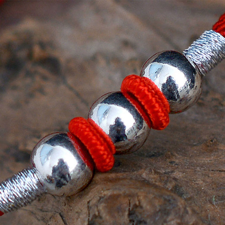 Braccialetto di corda rossa con perline portafortuna in argento sterling 925 Buddha Stones