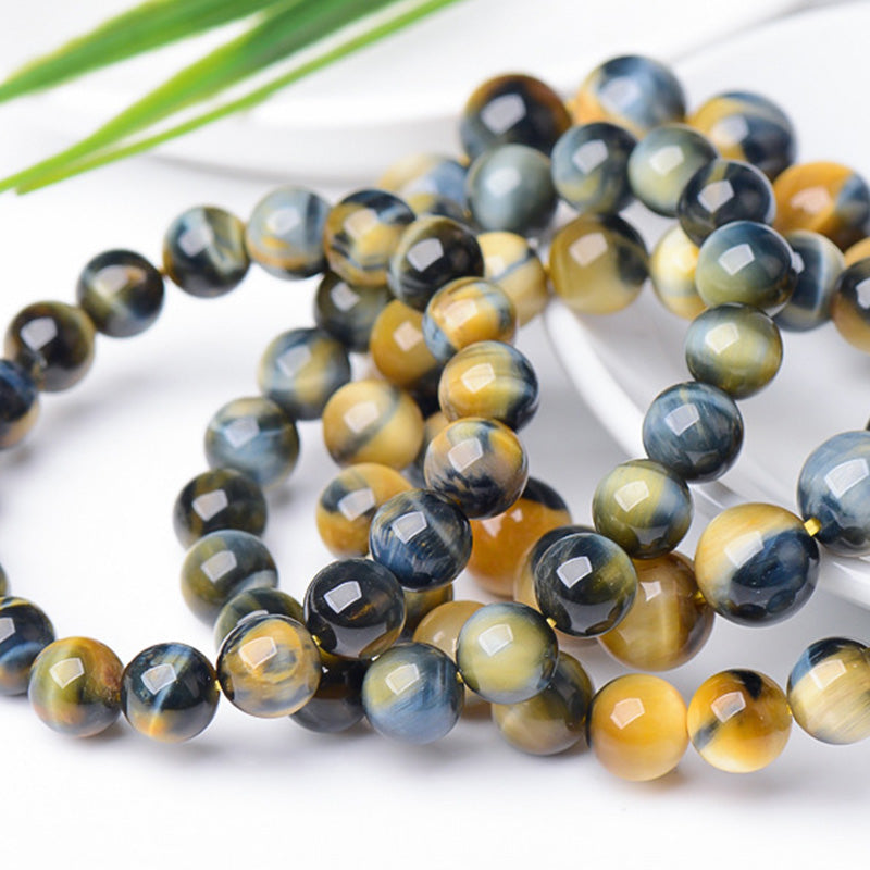 Braccialetto di protezione e forza con occhio di tigre Buddha Stones