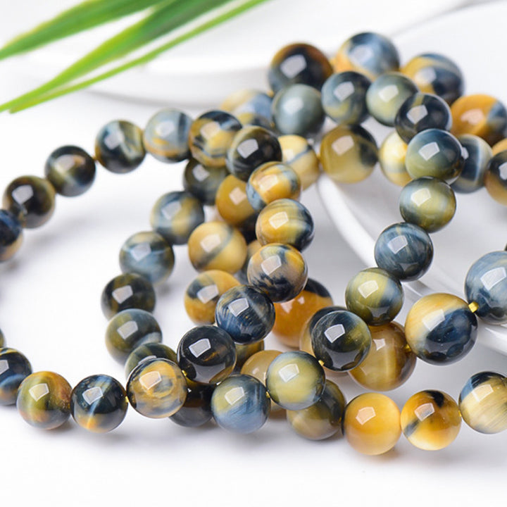 Braccialetto di protezione e forza con occhio di tigre Buddha Stones