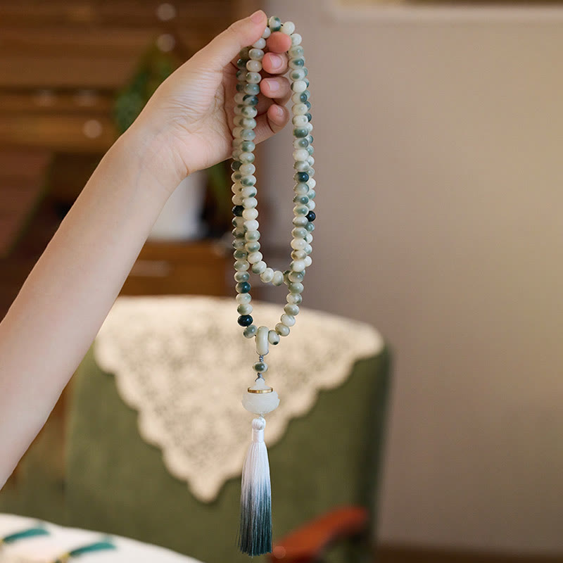 Buddha Stones naturali 108 perle Mala Bodhi Seed Lotus inciso braccialetto di saggezza nappa