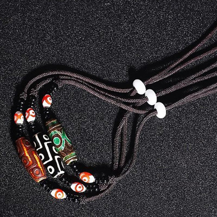 Buddha Stones Collana di perline tibetane Dzi a nove occhi con cordino protettivo - image 10