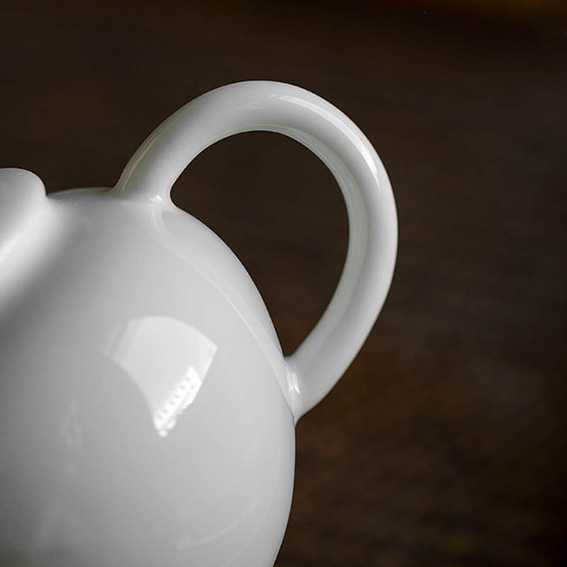 Teiera in ceramica con motivo inciso in bambù e pino prugna bianca