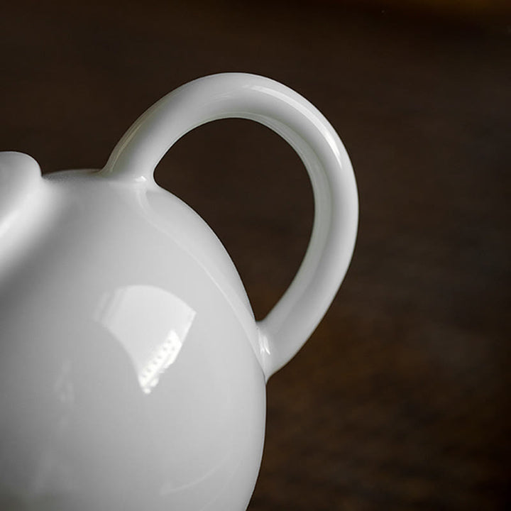 Teiera in ceramica con motivo inciso in bambù e pino prugna bianca