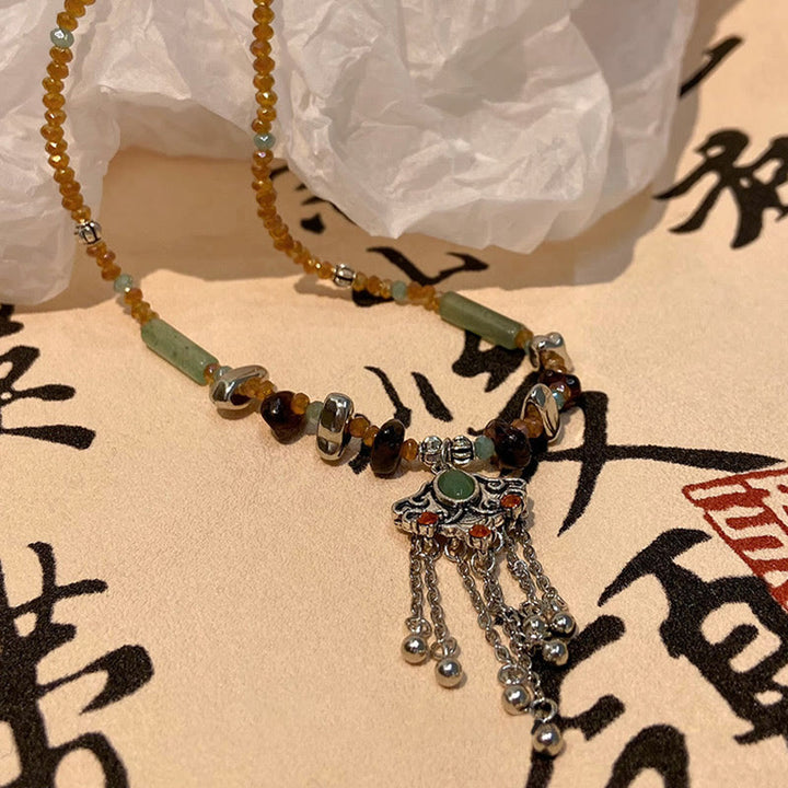 Buddha Stones Pietra di cristallo tibetana Collana pendente con nappa portafortuna in rame