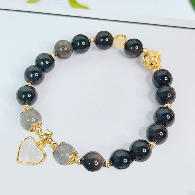 Braccialetto di protezione con cuore, stella e fiore in ossidiana naturale con Buddha Stones argento lucido