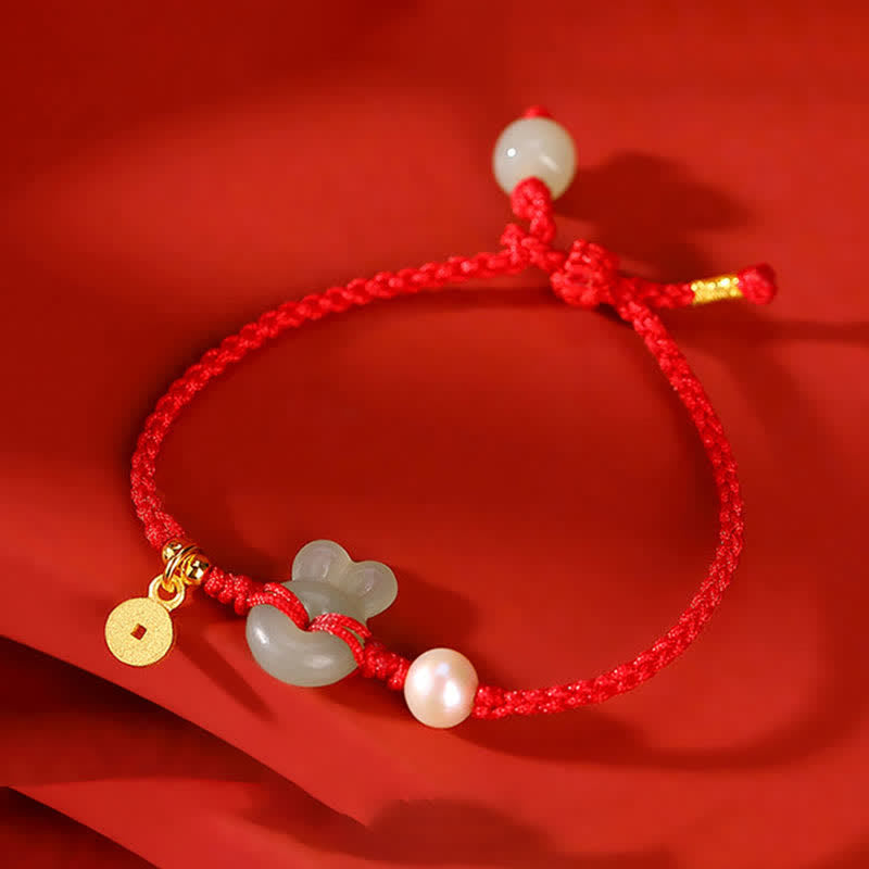 Braccialetto in corda rossa con moneta di rame e giada di Hetian dell'anno del coniglio in argento sterling 925
