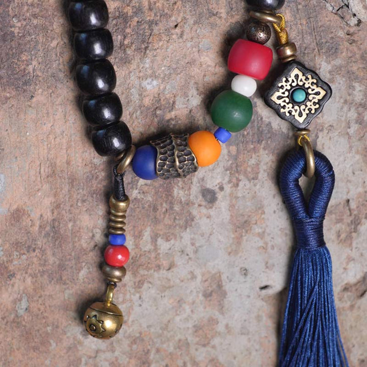 Buddha Stones 108 Perline Mala Legno di Ebano Dzi Perline Rame Braccialetto con Nappa