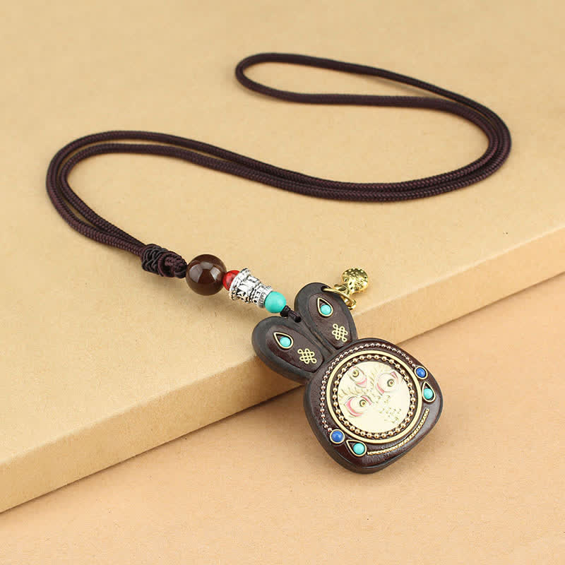 Collana pendente Thangka con cinque divinità della ricchezza in ebano tibetano