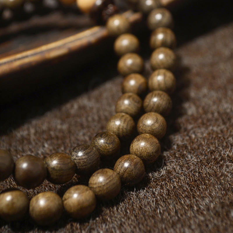 Bracciale Mala con ciondolo di protezione in legno di sandalo tibetano Buddha Stones