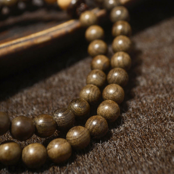 Bracciale Mala con ciondolo di protezione in legno di sandalo tibetano Buddha Stones