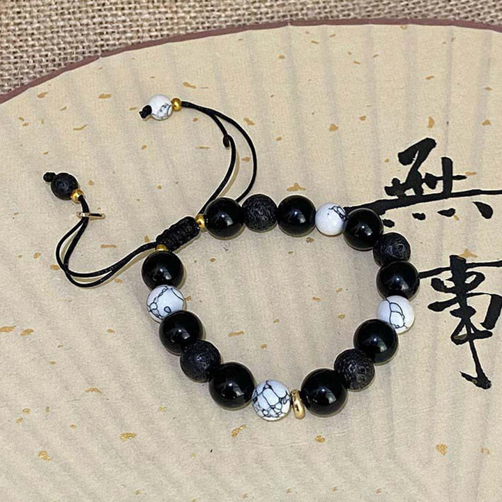 Braccialetto di forza Yin Yang in pietra lavica di ossidiana nera Buddha Stones