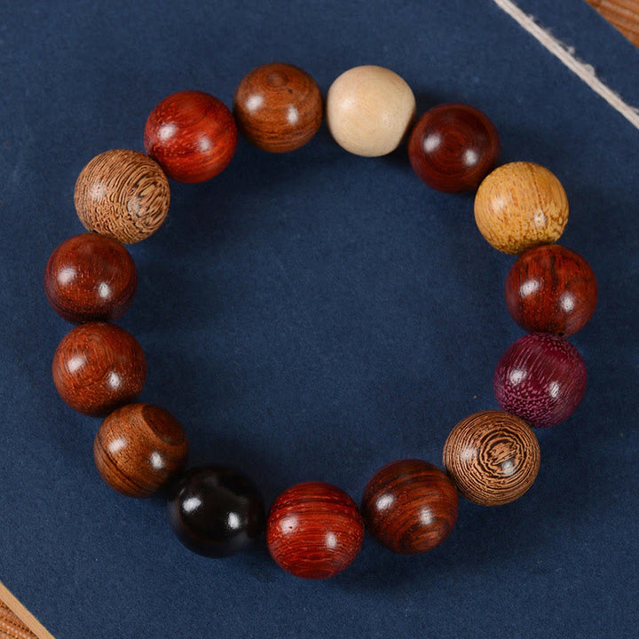 Braccialetto di guarigione di protezione multicolore in legno di sandalo Buddha Stones