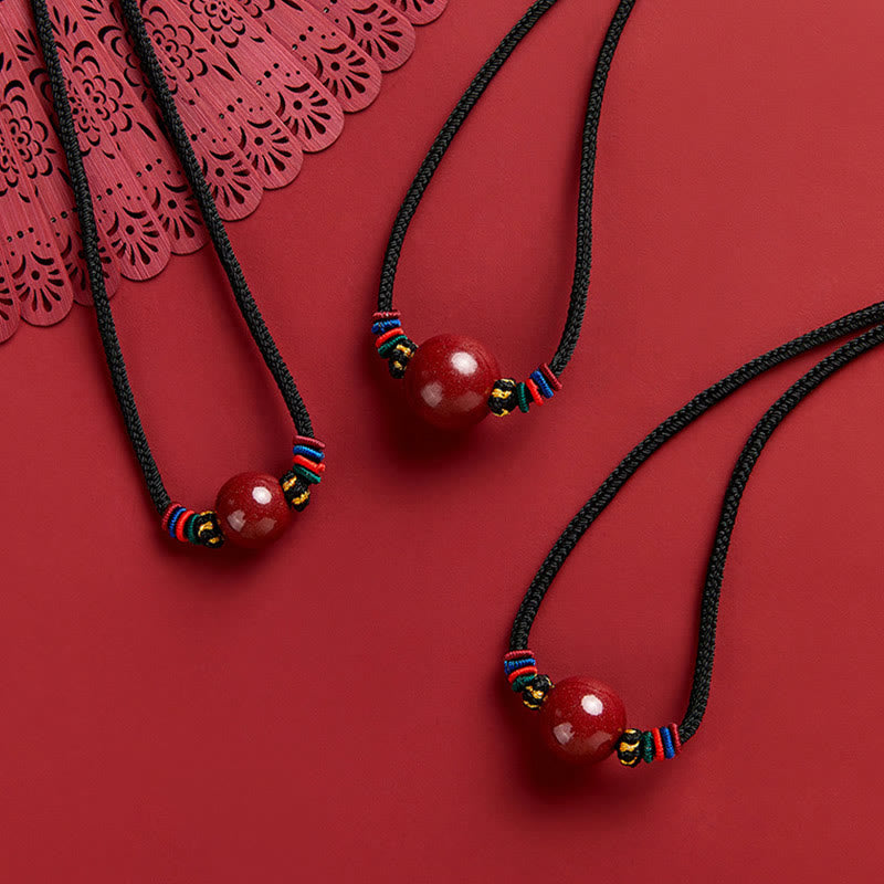 Collana con ciondolo in corda di benedizione con perline di cinabro e Buddha Stones