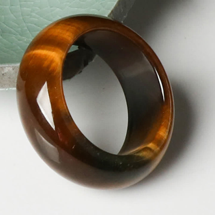 Anello di protezione della forza della pietra dell'occhio di tigre Buddha Stones