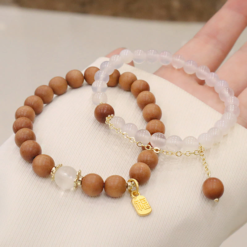 Braccialetto di protezione con ciondolo a forma di carattere Fu con occhio di gatto Buddha Stones in legno di sandalo