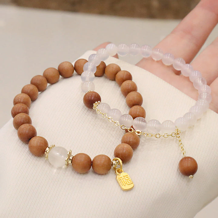 Braccialetto di protezione con ciondolo a forma di carattere Fu con occhio di gatto Buddha Stones in legno di sandalo