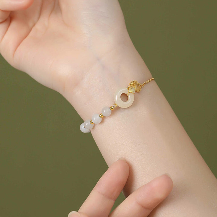 Braccialetto della fortuna con foglia di ginkgo e fibbia della pace in argento sterling 925 con Buddha Stones e giada bianca Hetian