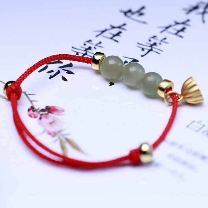 Braccialetto intrecciato con corda rossa in semi di loto di giada naturale Buddha Stones