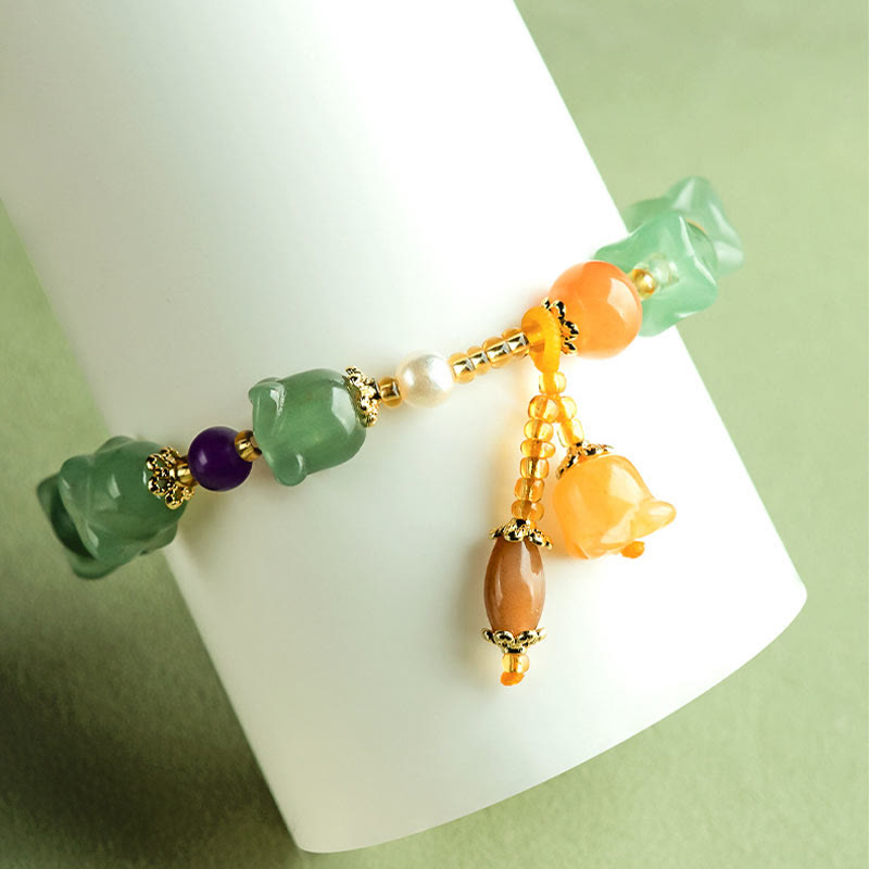 Braccialetto della fortuna con fiore di magnolia, avventurina verde Buddha Stones