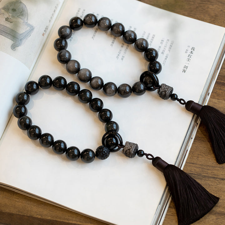 Buddha Stones Argento naturale Ossidiana lucida Ossidiana nera Leone Mala da polso Protezione Nappe Mala tascabile Decorazione per auto