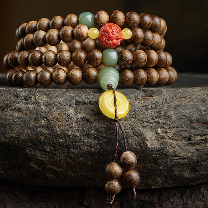 Buddha Stones 108 perle di Mala Kalimantan Agarwood Zucca Giada Ambra Bracciale equilibrio