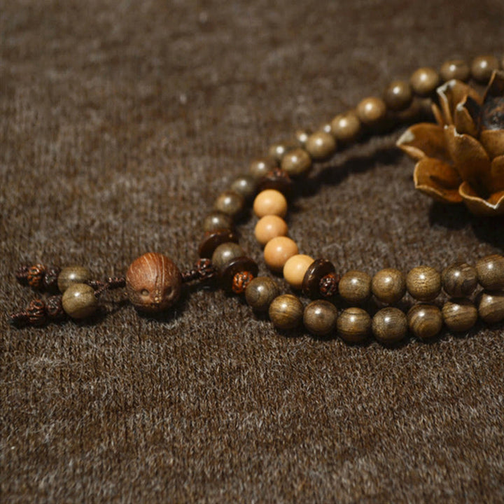 Bracciale Mala con ciondolo di protezione in legno di sandalo tibetano Buddha Stones