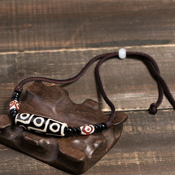 Buddha Stones Collana di perline tibetane Dzi a nove occhi con cordino protettivo - image 2