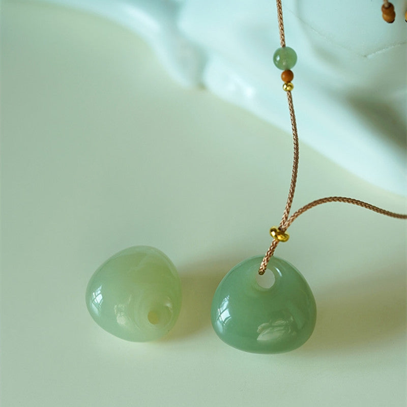 Collana con ciondolo portafortuna e prosperità in giada naturale Buddha Stones. - image 1