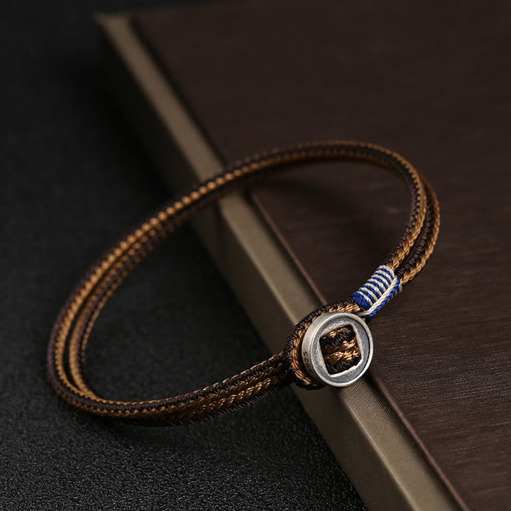 Braccialetto con cordino intrecciato di protezione con bottone fatto a mano in argento sterling 925 Buddha Stones