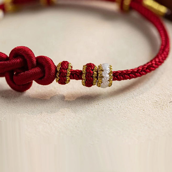 Braccialetto con corda portafortuna con ciondolo a forma di fiore di pesco con nodo d'amore fatto a mano Buddha Stones