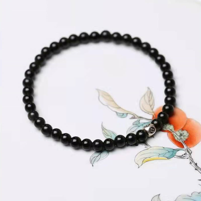 Bracciale Buddha Stones in ossidiana nera naturale e quarzo fumé per la forza di purificazione