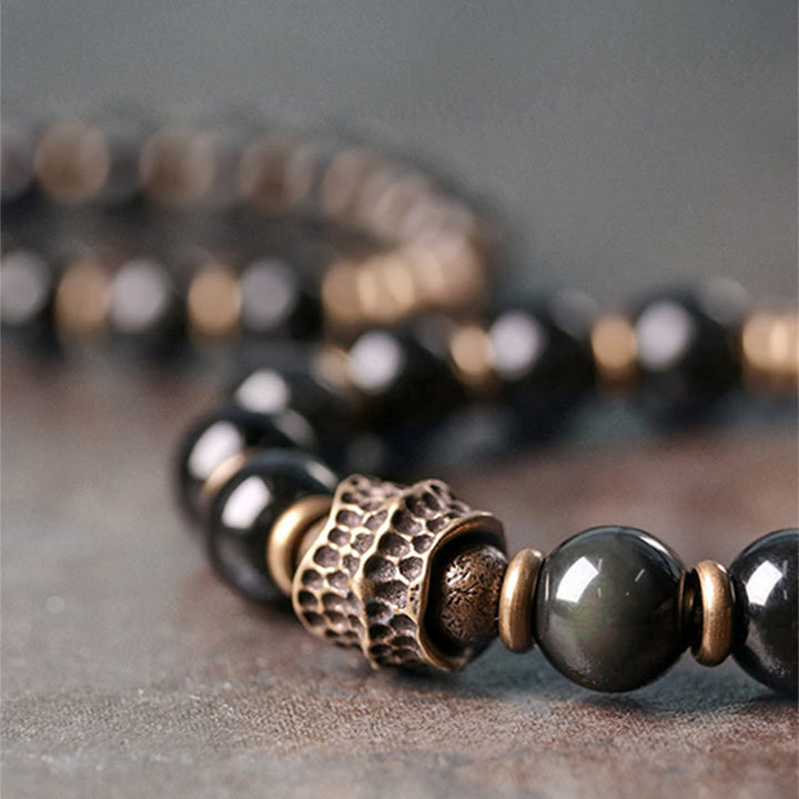 Braccialetto di guarigione dell'amore in rame e ossidiana arcobaleno Buddha Stones
