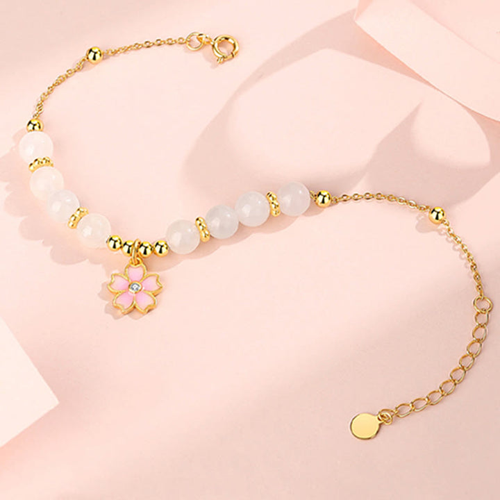 Braccialetto di protezione in giada bianca Hetian con fiori di ciliegio in argento sterling 925 Buddha Stones