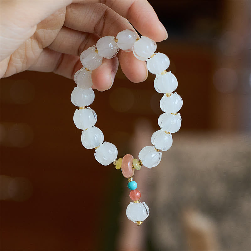 Braccialetto dell'illuminazione con ciondolo leone danzante avorio, perline di vetro Liuli, motivo loto, fluorite e Buddha Stones