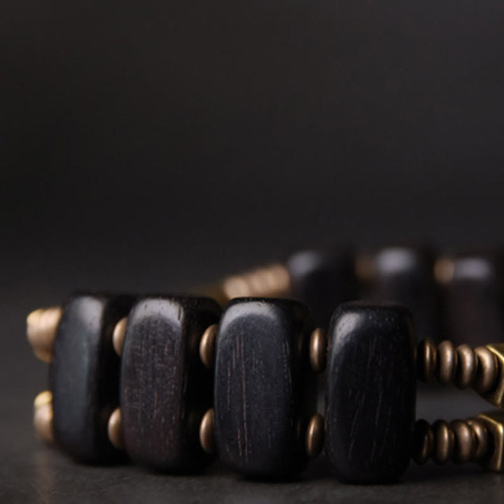 Braccialetto a doppio strato in ebano tibetano con Buddha Stones e rame