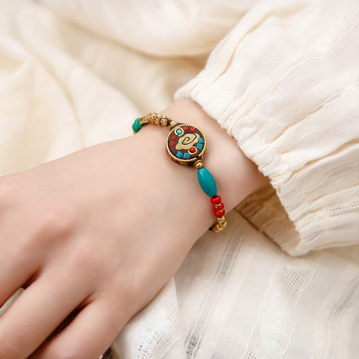 Braccialetto di protezione e forza Buddha Stones in turchese tibetano Om Mani Padme Hum
