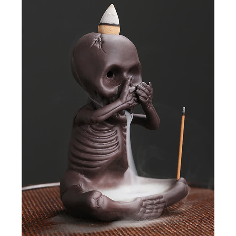 Buddha Stones Piccolo teschio Fantasma Argilla viola Fontana di fumo a riflusso Bruciatore di incenso della pace Decorazione