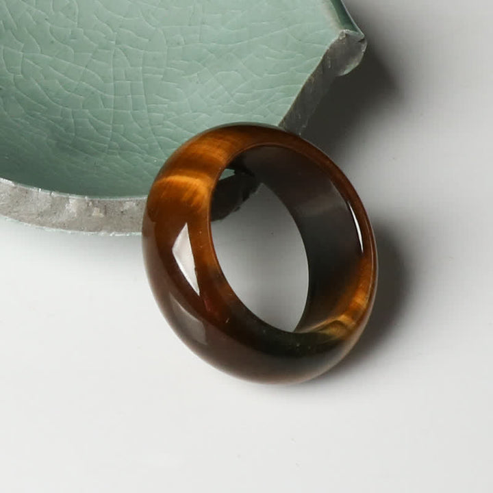 Anello di protezione della forza della pietra dell'occhio di tigre Buddha Stones