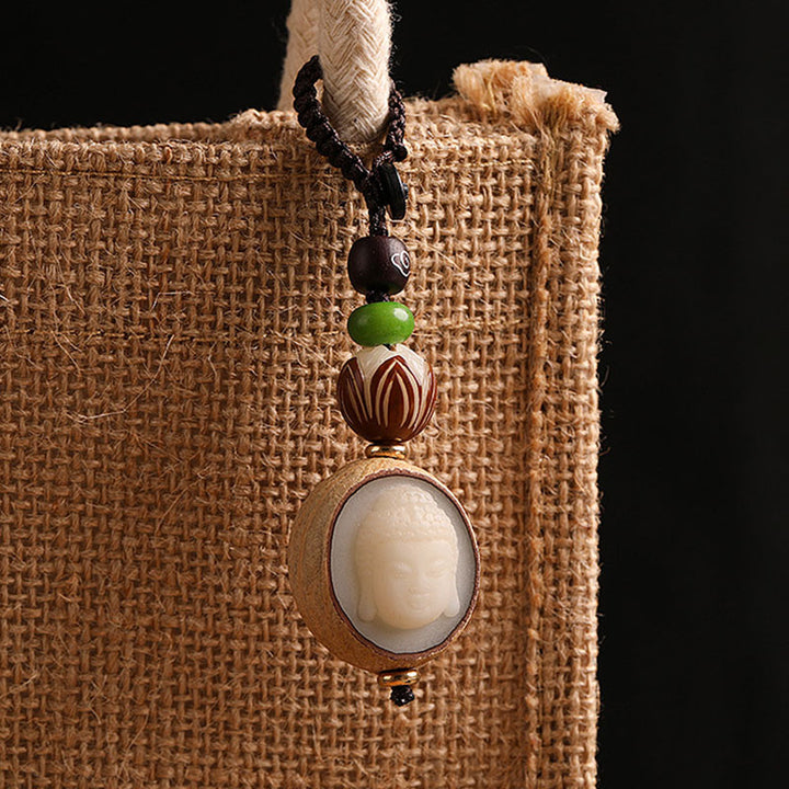 Portachiavi con decorazione Buddha Stones semi di Bodhi