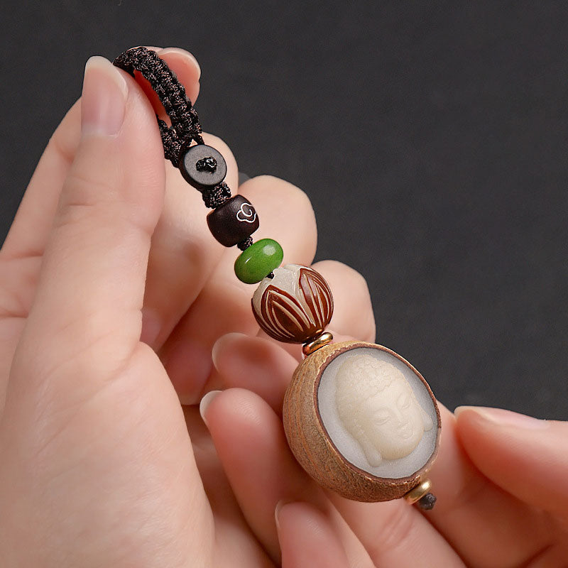 Portachiavi con decorazione Buddha Stones semi di Bodhi