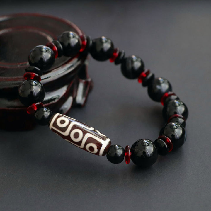 Braccialetto di protezione della ricchezza con perline Dzi a nove occhi in onice nero Buddha Stones