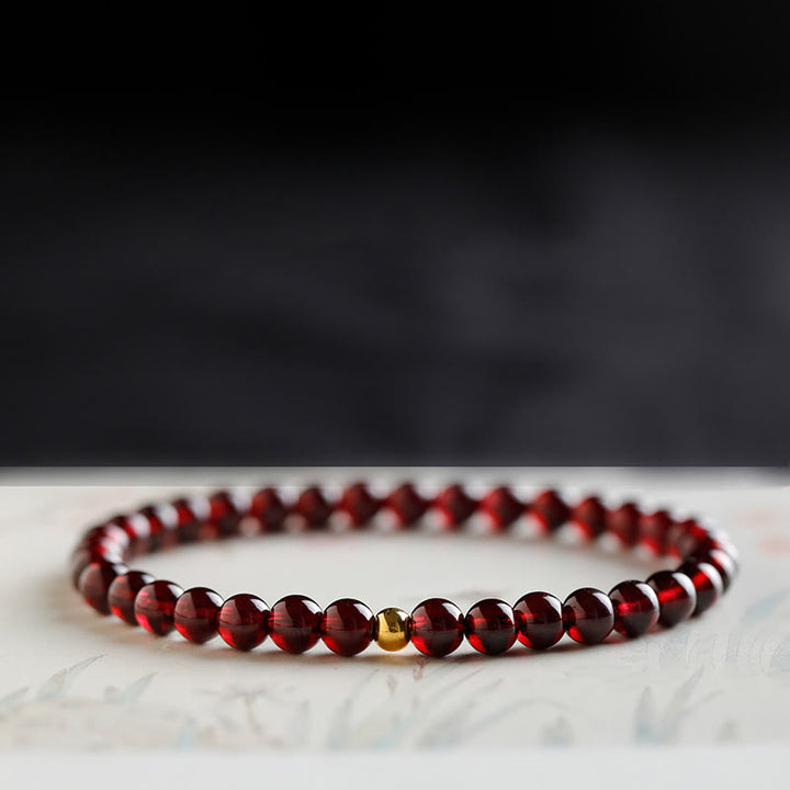 Braccialetto di protezione in granato naturale con pesce koi in oro 999 Buddha Stones