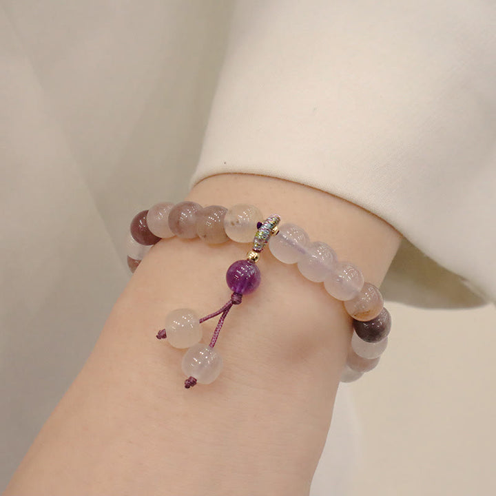 Braccialetto di perline con ciondolo a forma di fiore viola dorato naturale di seta Buddha Stones
