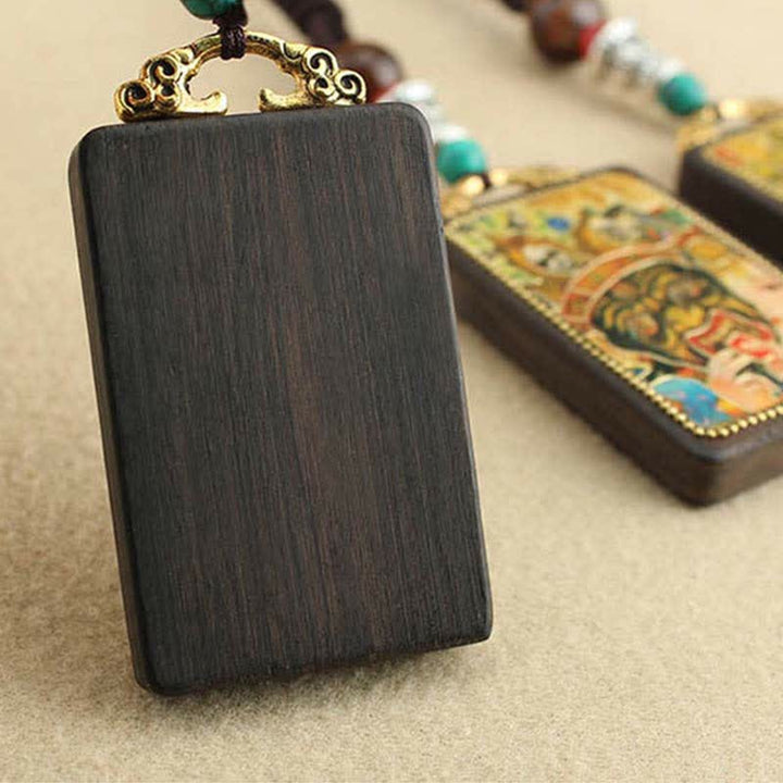 Buddha Stones Tibet Dio della Ricchezza Thangka Ebano Collana Pendente della Pace