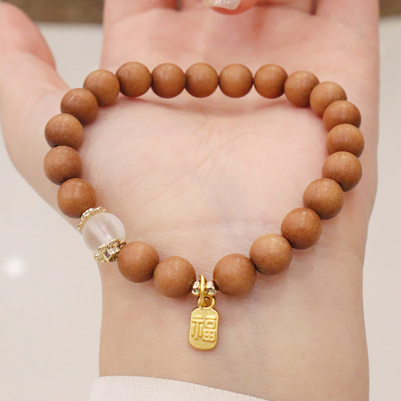 Braccialetto di protezione con ciondolo a forma di carattere Fu con occhio di gatto Buddha Stones in legno di sandalo